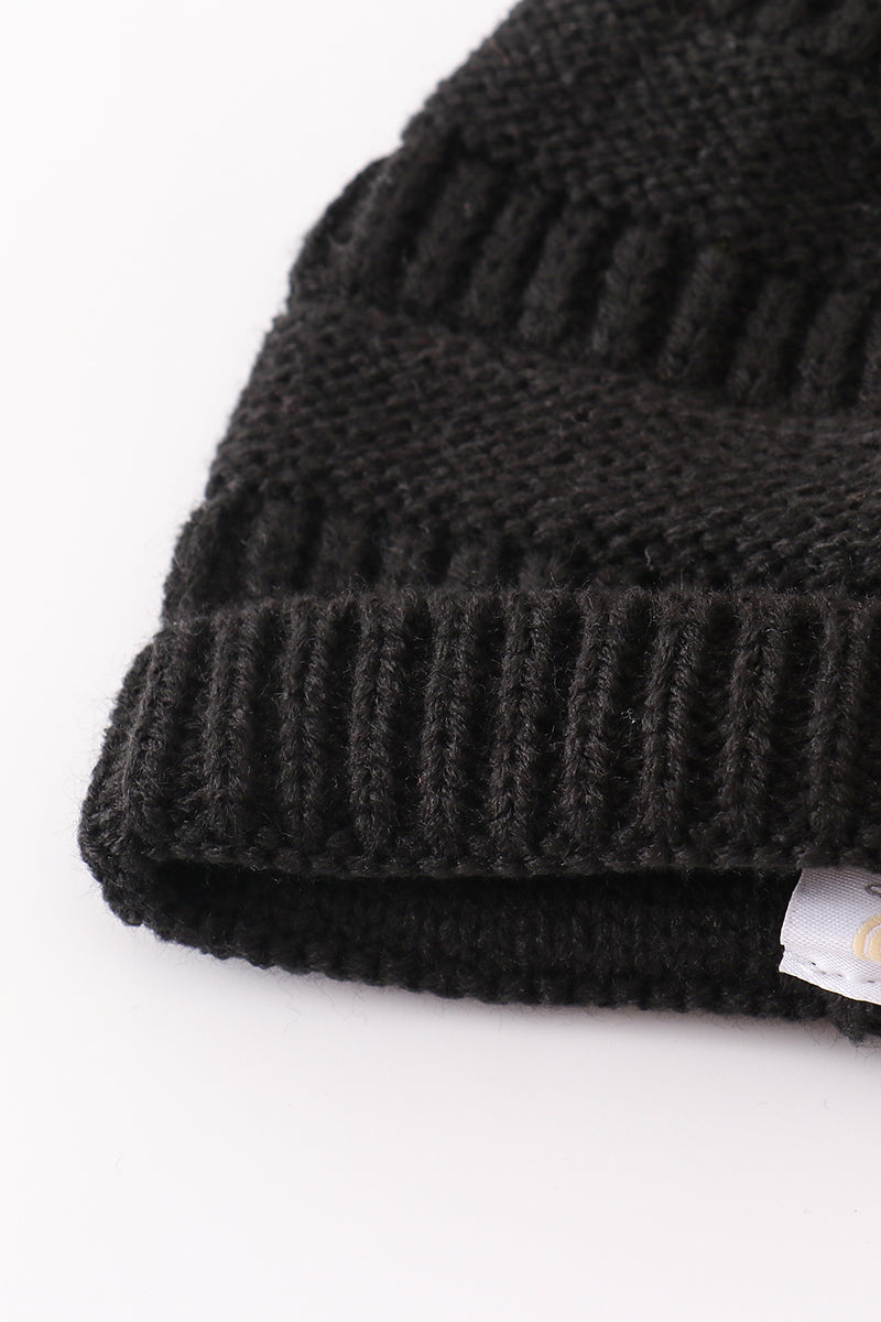 Black pompom cable beanie