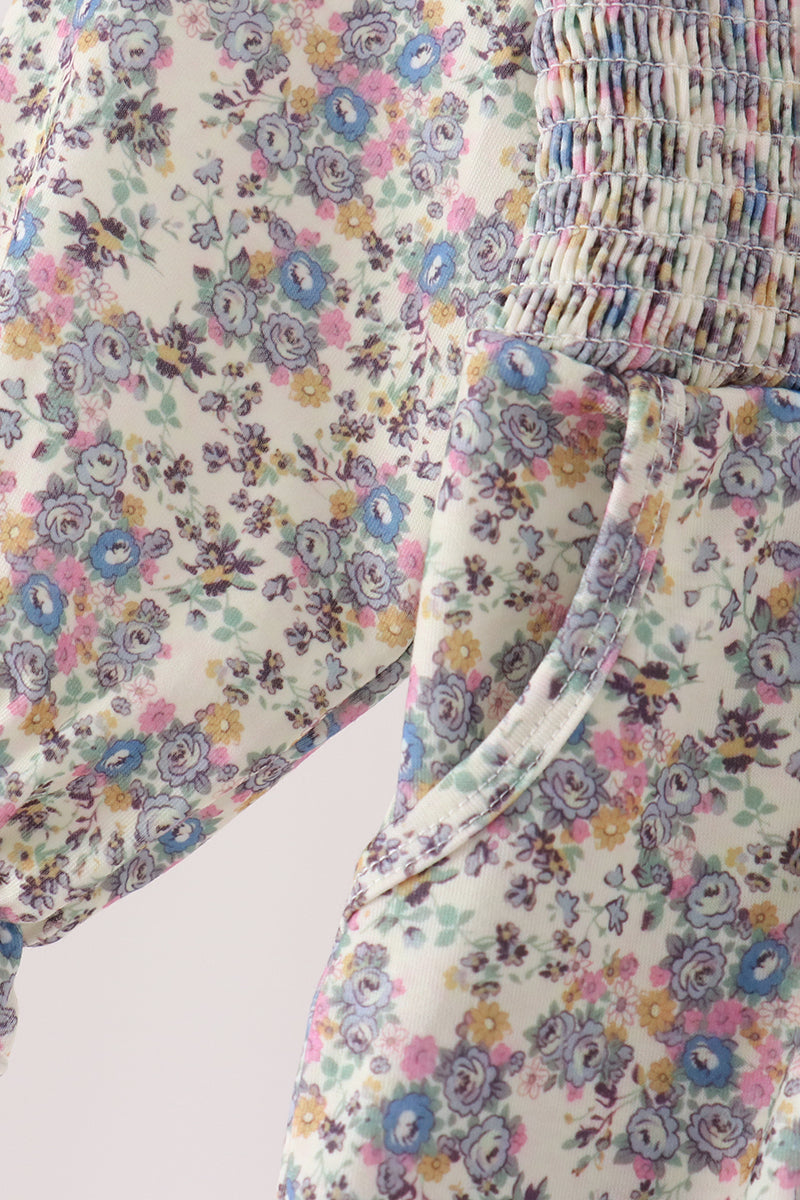 Blue floral smocked jumpsuit